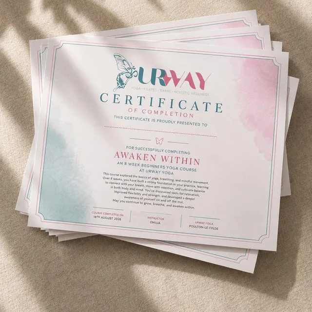 URWAY certificates of completion for the Awaken Within eight-week beginners yoga course, laid on a linen surface in dappled sunlight